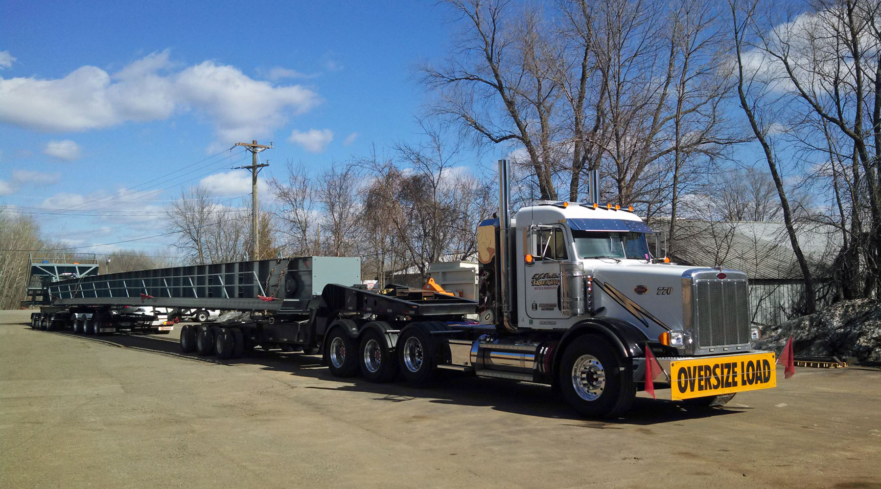 Oversize load with steerable dolly Trucking